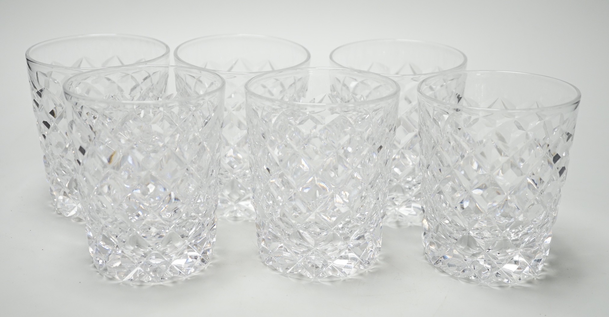 A set of six heavy hobnail cut glass whisky tumblers. 10cm high